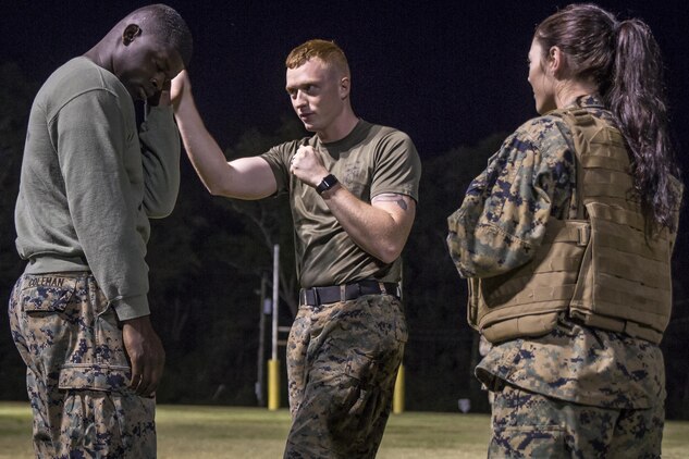 Cpl. Jamie Brooks instructs Marines as they prepare for a Marine Corps Martial Arts belt test aboard Marine Corps Air Station Beaufort, May 15. Brooks is a Marine Corps Martial Arts Program Instructor and sports coach. He spends two hours every morning teaching Marines MCMAP and volunteers for an hour after work three times a week to coach a youth sports team. He also spends one weekend a month volunteering at events in the local Beaufort community. Brooks is an administrative specialist with Headquarters and Headquarters Squadron.