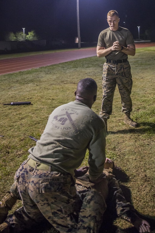 Cpl. Jamie Brooks instructs Marines as they prepare for a Marine Corps Martial Arts belt test aboard Marine Corps Air Station Beaufort, May 15. Brooks is a Marine Corps Martial Arts Program Instructor and sports coach. He spends two hours every morning teaching Marines MCMAP and volunteers for an hour after work three times a week to coach a youth sports team. He also spends one weekend a month volunteering at events in the local Beaufort community. Brooks is an administrative specialist with Headquarters and Headquarters Squadron.