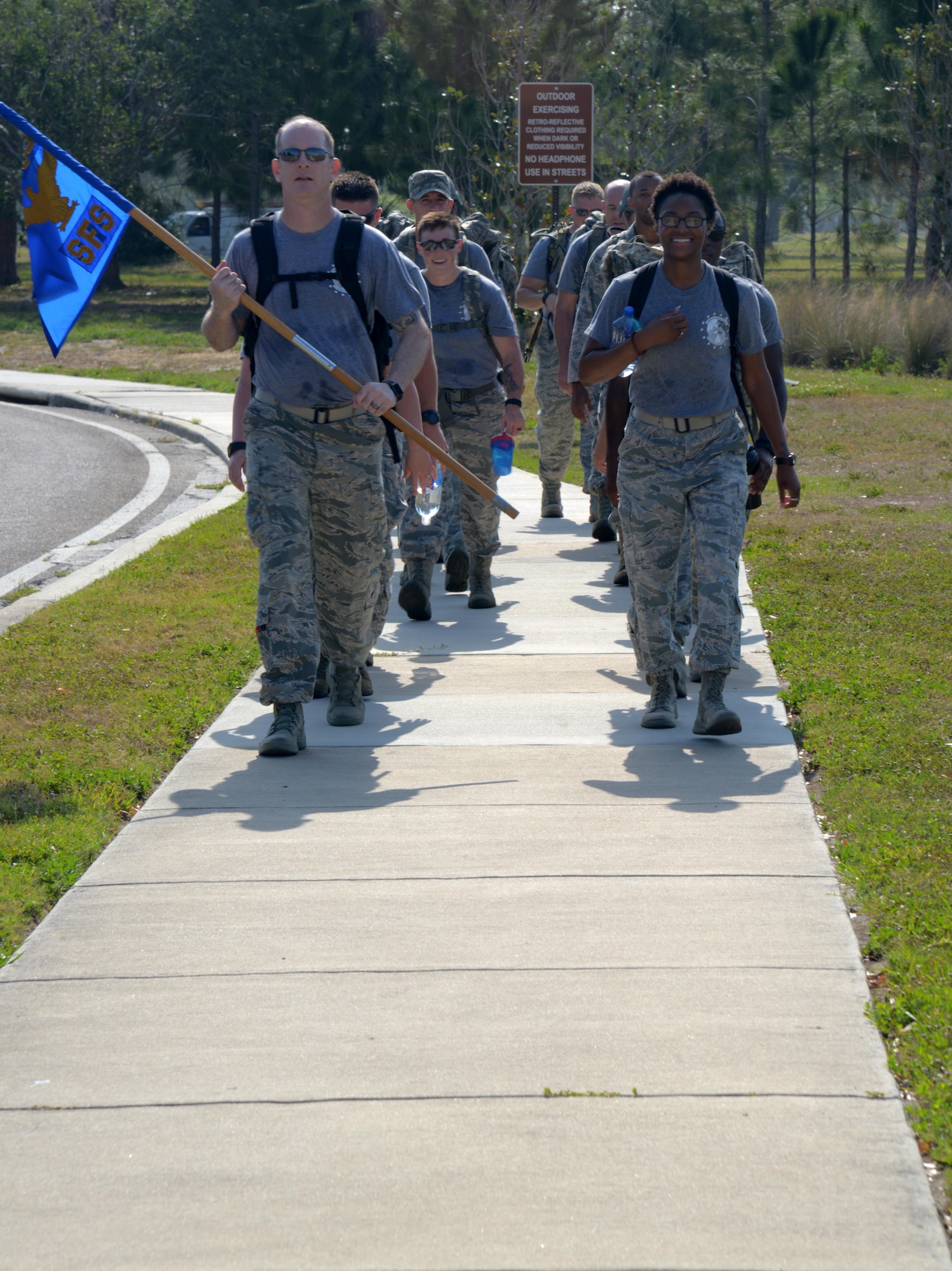 Members from the 6th Security Forces Squadron complete a 5K ruck march in honor of National Police Week at MacDill Air Force Base, Fla., May 15, 2017. MacDill celebrated National Police Week with several events to commemorate the contributions and sacrifices of law enforcement officials around the world. (U.S. Air Force photo by Senior Airman Tori Long)