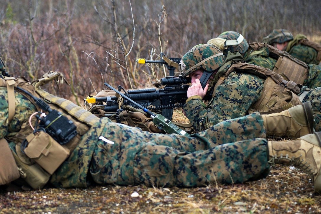 A Marine simulates calling in mortar fire during exercise Northern Edge at Fort Greely, Alaska, May 9, 2017. The Marines are assigned to the 5th Air Naval Gunfire Liaison Company. Air Force photo by Airman 1st Class Isaac Johnson