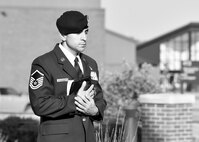 Master Sgt. Loren Mount, 910th Security Forces Squadron (SFS) flight sergeant, holds a police memorial flag before raising it to half-mast outside the headquarters building here, May 17, 2017. SFS members held a ceremony with representatives from local law enforcement agencies in recognition of Police Week. The ceremony honored the selfless service of U.S. police officers who have fallen in the line of duty. (U.S. Air Force photo/Eric White)
