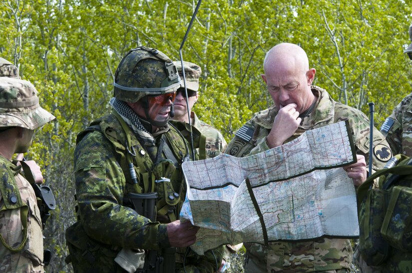 Lt. Gen. Charles Luckey, chief of Army Reserve and commanding general of United States Army Reserve Command, discusses troop movements with Canadian Lt. Col. Will Graydon, commanding officer of the 3rd Battalion, Royal Canadian Regiment, on May 18, 2017, in Camp Wainwright, Alberta, Canada, during Maple Resolve 17.  More than 650 U.S. Army Soldiers are supporting Maple Resolve 17, the Canadian Army’s premiere brigade-level validation exercise running May 14-29 at Camp Wainwright. As part of the exercise, the U.S. Army is providing a wide array of combat and support elements. These include sustainment, psychological operations, public affairs, aviation and medical units. (U.S. Army Reserve photo by Staff Sgt. Michael Crawford)