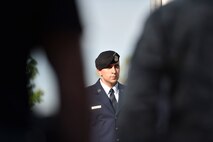 Master Sgt. Loren Mount, 910th Security Forces Squadron (SFS) flight sergeant, faces a police memorial flag after raising it to half-mast outside the headquarters building here, May 17, 2017. SFS members held a ceremony with representatives from local law enforcement agencies in recognition of Police Week. The ceremony honored the selfless service of U.S. police officers who have fallen in the line of duty. (U.S. Air Force photo/Eric White)