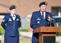 Lt. Col. Scott Stewart, 910th Security Forces Squadron commander, reads a proclamation during a Police Week ceremony here, May 17, 2017.  Staff Sgt. Emily Uhlir, 910th SFS fire team member, stands behind Stewart. Uhlir narrated the ceremony, which SFS held along with representatives from local law enforcement agencies. The ceremony honored the selfless service of U.S. police officers who have fallen in the line of duty. (U.S. Air Force photo/Eric White)