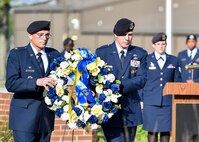 Lt. Col. Scott Stewart, 910th Security Forces Squadron commander, and Capt. Nicholas Megyesi, SFS operations officer, lay a commemorative wreath at the base of the flag pole during a Police Week ceremony here, May 17, 2017.  SFS held the ceremony with representatives from local law enforcement agencies. The ceremony honored the selfless service of U.S. police officers who have fallen in the line of duty. (U.S. Air Force photo/Eric White)