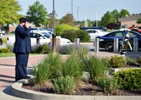 Lt. Col. Scott Stewart, 910th Security Force Squadron commander, and Capt. Nicholas Megyesi, SFS operations officer, salute a wreath commemorating police officers who have fallen in the line of duty during a Police Week ceremony here, May 17, 2017.  SFS held the ceremony with representatives from local law enforcement agencies. The ceremony honored the selfless service of U.S. police officers who have fallen in the line of duty. (U.S. Air Force photo/Eric White)