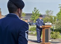 Tech. Sgt. Wesley Whitaker, 910th Security Forces Squadron (SFS) fire team leader, reads names of police officers who gave their lives in the line of duty during a Police Week ceremony here, May 17, 2017. SFS held the ceremony with representatives from local law enforcement agencies. Master Sgt. Loren Mount, flight sergeant, looks on. (U.S. Air Force photo/Eric White)