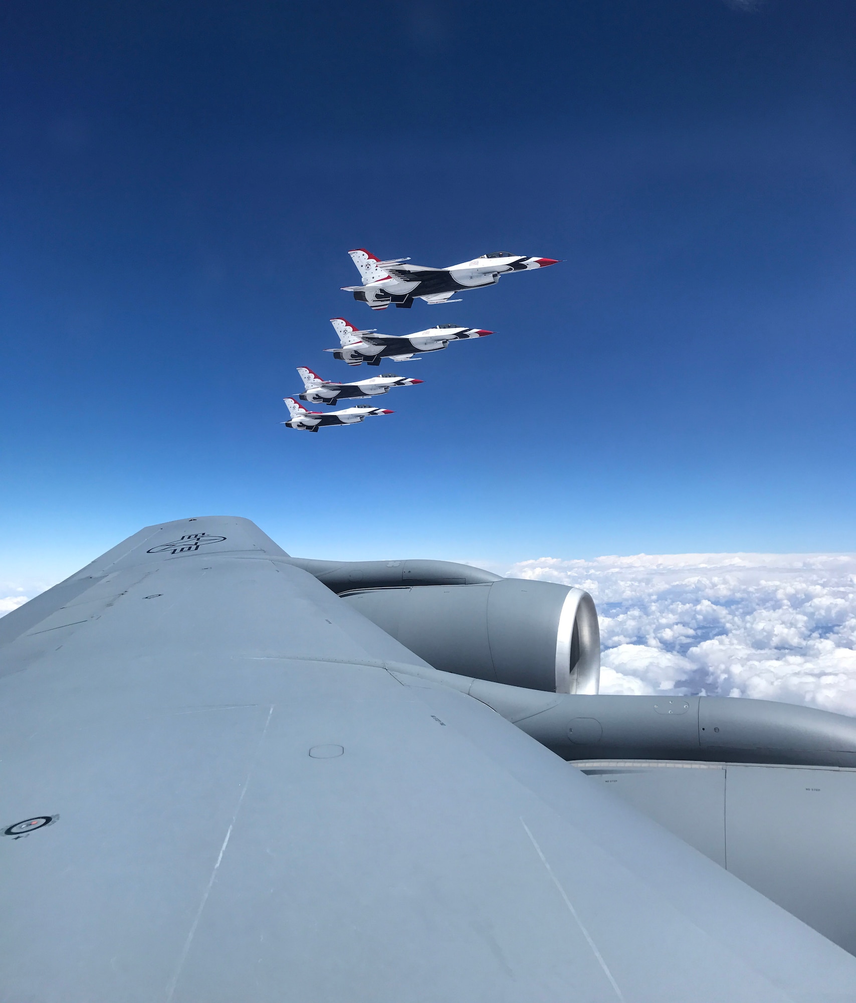 A view of four U.S. Air Force Thunderbirds flanked alongside an Okie KC-135 Stratotanker assigned to the 465th Air Refueling Squadron, 507th Air Refueling Wing, as they await refueling May 18, 2017, on their journey to Tinker Air Force Base for the 2017 Star Spangled Salute Air Show. The air show, scheduled for May 20-21, will commemorate the 75th Anniversary of Tinker AFB. (U.S. Air Force photo/Tech. Sgt. Lauren Gleason)