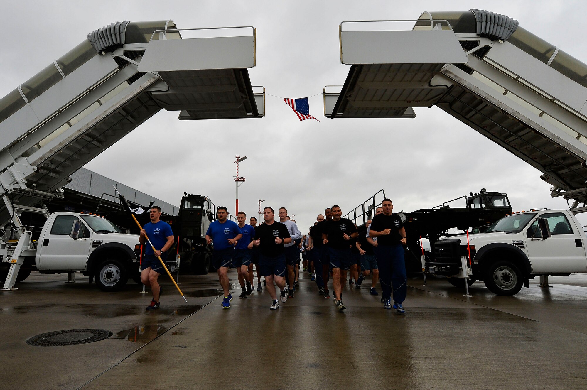 721st Aerial Port Squadron Airmen conduct a memorial run on Ramstein Air Base, Germany, May 19, 2017. The event is part of a tradition in the aerial port career field, in which aerial port squadrons conduct memorial runs to honor their fallen colleagues. (U.S. Air Force photo by Airman 1st Class Joshua Magbanua) 