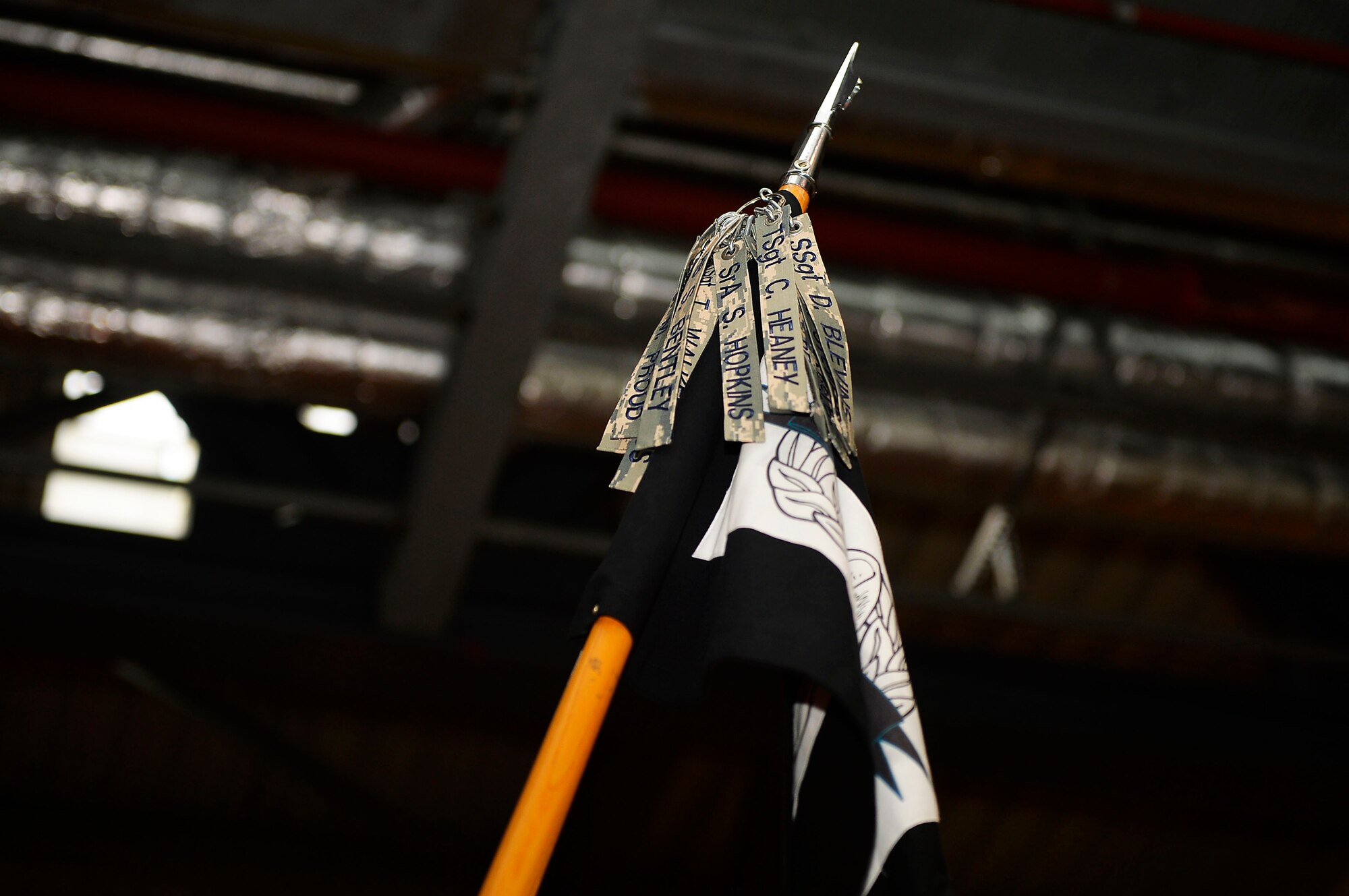 Name tapes of fallen aerial port Airmen are attached to a banner during a memorial ceremony on Ramstein Air Base, Germany, May 19, 2017. Airmen of the 721st Aerial Port Squadron held a memorial run in honor of four of their colleagues who died over the past year in separate duty locations. (U.S. Air Force photo by Airman 1st Class Joshua Magbanua) 