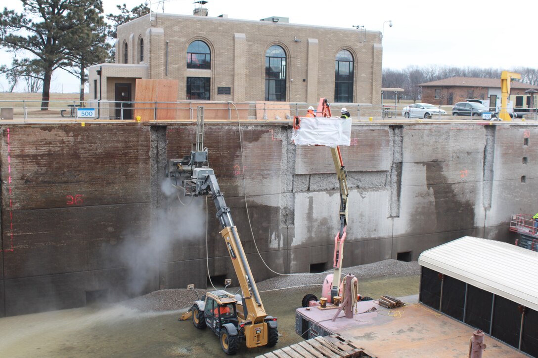 A hydro-demolition machine being used at Lock 17 on the Mississippi River to remove old concrete from the lock walls.