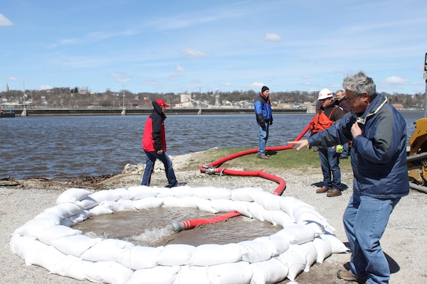 John Quick, engineering technician, explains how to properly contain a boil with sandbags during Flood Fight Training.