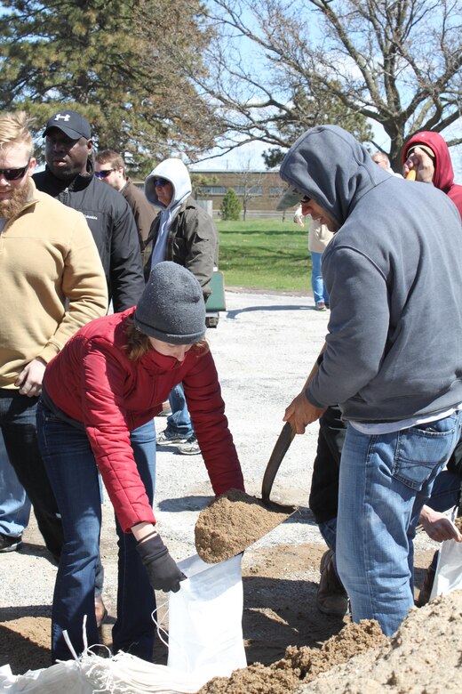 Rock Island District employees train on the various methods of filling and laying sandbags during Flood Fight Training.