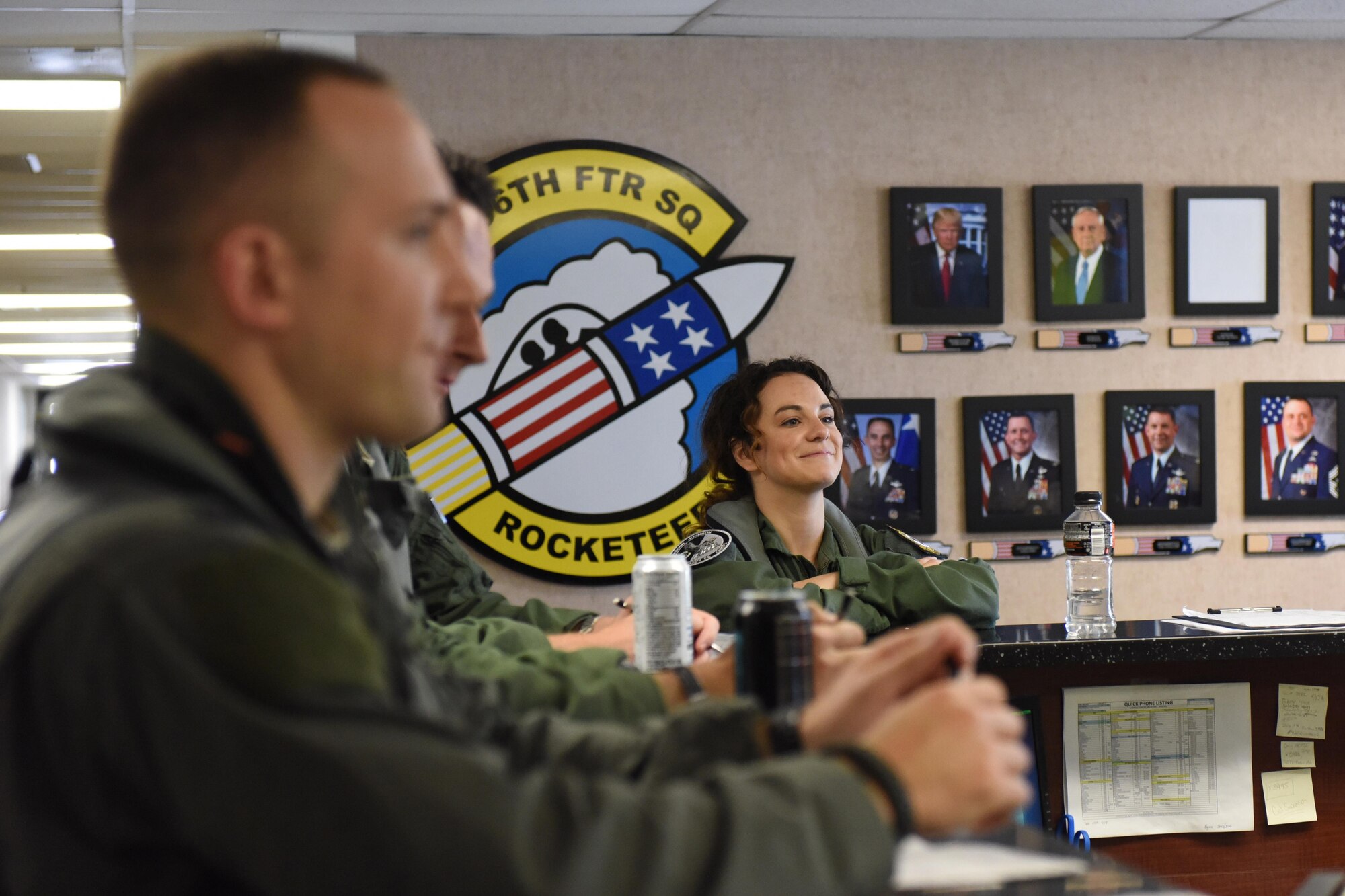 Members of the 336th Fighter Squadron briefed Danika Portz, singer song-writer, prior to her incentive flight in an F-15E Strike Eagle, May 17, 2017, at Seymour Johnson Air Force Base, North Carolina. Portz will perform the National Anthem at the Wings Over Wayne Air Show, headlined by the U.S. Navy Blue Angels premiere aerial demonstration team, May 20-21, 2017. (U.S. Air Force photo by Airman 1st Class Miranda A. Loera)