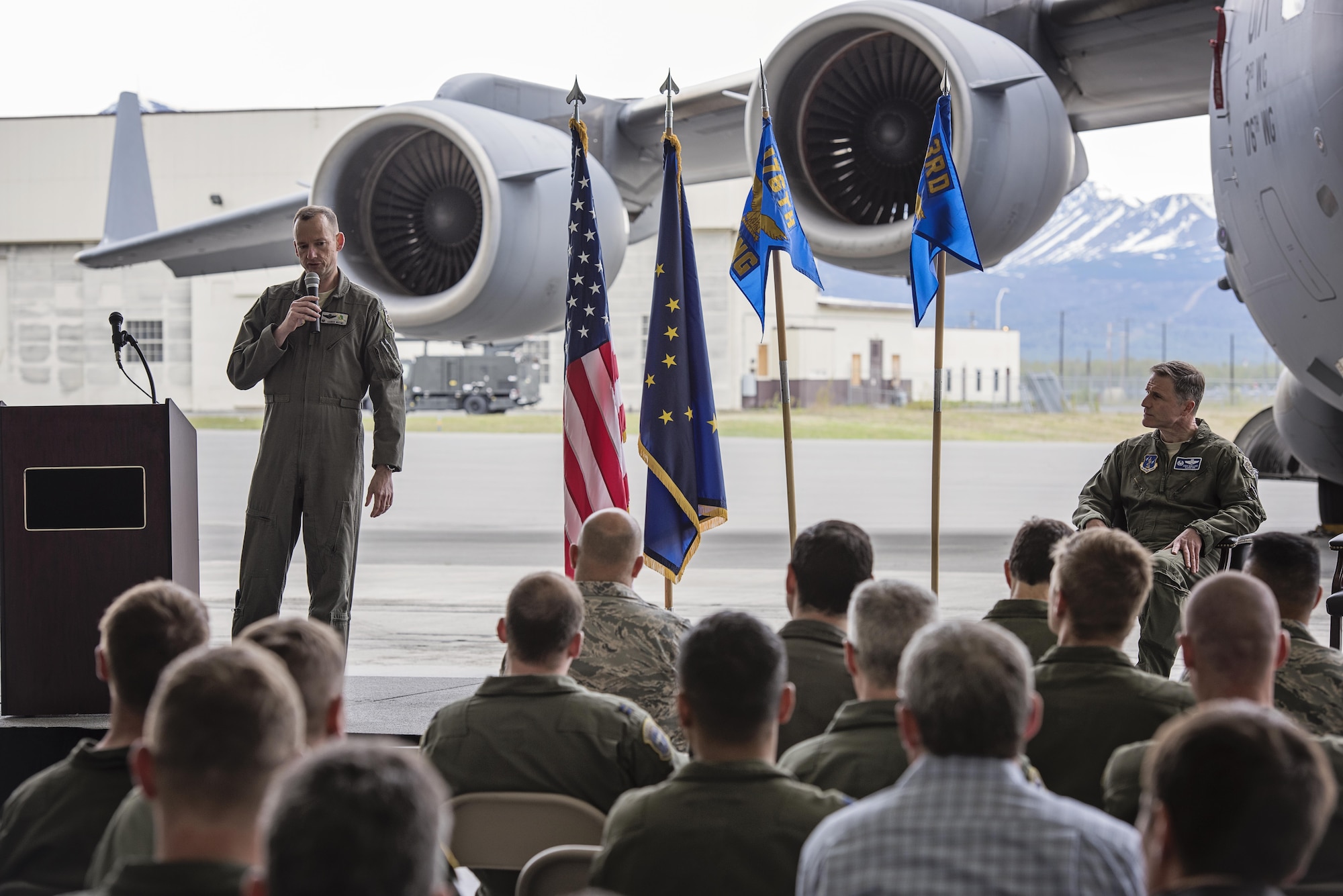 Col. Steven deMilliano, commander of the 176th Wing, Alaska Air National Guard, and Col. Christopher Niemi, commander of the 3rd Wing, U.S. Air Force, commemorated the change of assignment of eight C-17 Globe Master III aircraft based here during a ceremony on Joint Base Elmendorf-Richardson, Alaska, May 17. The two commanders took turns speaking to Airmen from both Wings about the transfer of the aircraft from active duty to the Guard and how the units will continue to support the C-17 mission together in the arctic and Pacific regions. (U.S. Air National Guard photo by Staff Sgt. Edward Eagerton/released)