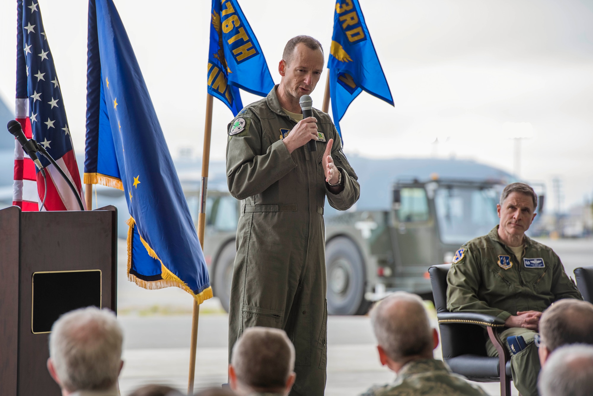 Col. Steven deMilliano, commander of the 176th Wing, Alaska Air National Guard, and Col. Christopher Niemi, commander of the 3rd Wing, U.S. Air Force, commemorated the change of assignment of eight C-17 Globe Master III aircraft based here during a ceremony on Joint Base Elmendorf-Richardson, Alaska, May 17. The two commanders took turns speaking to Airmen from both Wings about the transfer of the aircraft from active duty to the Guard and how the units will continue to support the C-17 mission together in the arctic and Pacific regions. (U.S. Air National Guard photo by Staff Sgt. Edward Eagerton/released)