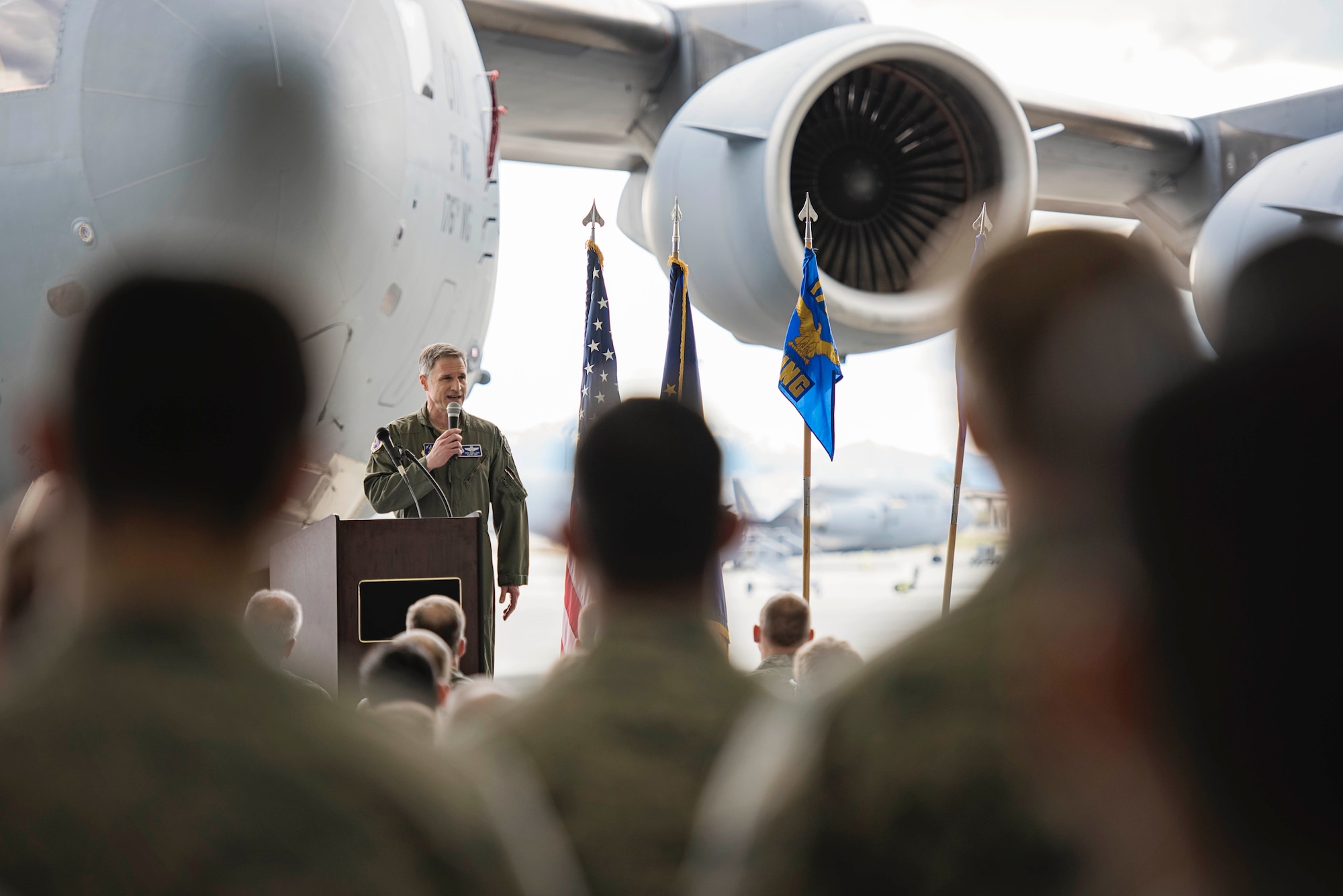 Col. Steven deMilliano, commander of the 176th Wing, Alaska Air National Guard, and Col. Christopher Niemi, commander of the 3rd Wing, U.S. Air Force, commemorated the change of assignment of eight C-17 Globe Master III aircraft based here during a ceremony on Joint Base Elmendorf-Richardson, Alaska, May 17. The two commanders took turns speaking to Airmen from both Wings about the transfer of the aircraft from active duty to the Guard and how the units will continue to support the C-17 mission together in the arctic and Pacific regions. (U.S. Air National Guard photo by Staff Sgt. Edward Eagerton/released)