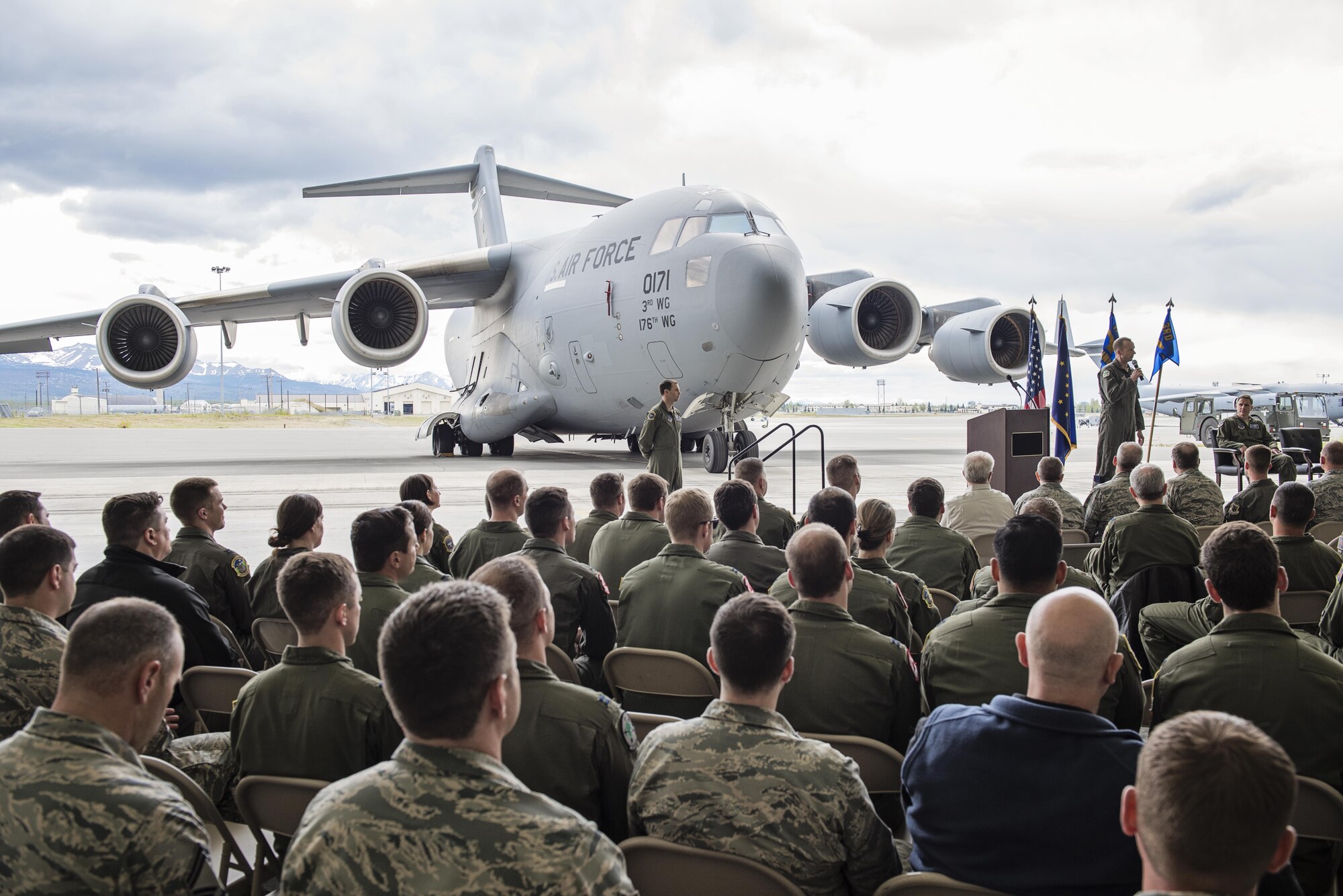 Col. Steven deMilliano, commander of the 176th Wing, Alaska Air National Guard, and Col. Christopher Niemi, commander of the 3rd Wing, U.S. Air Force, commemorated the change of assignment of eight C-17 Globe Master III aircraft based here during a ceremony on Joint Base Elmendorf-Richardson, Alaska, May 17. The two commanders took turns speaking to Airmen from both Wings about the transfer of the aircraft from active duty to the Guard and how the units will continue to support the C-17 mission together in the arctic and Pacific regions. (U.S. Air National Guard photo by Staff Sgt. Edward Eagerton/released)