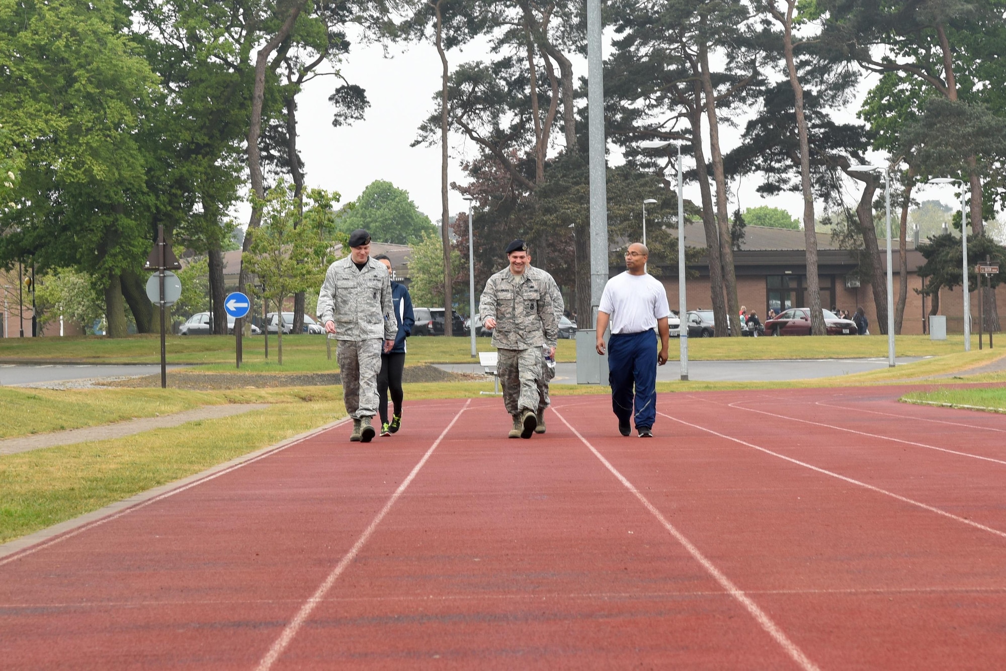 Airmen assigned to the 48th Fighter Wing participate in a memorial walk at Royal Air Force Lakenheath, England, May 12. The first day of National Police Week included an opening ceremony, a ruck march and a 24-hour memorial walk to remember defenders who have lost their lives. (U.S. Air Force photo/Airman 1st Class Eli Chevalier)