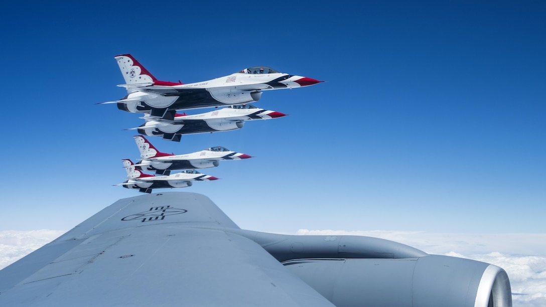 Four F-16 Fighting Falcons assigned to the Thunderbirds, the Air Force’s air demonstration squadron, fly off the wing of a KC-135 Stratotanker before conducting an aerial refueling en route to Tinker Air Force Base, Okla., May 18, 2017. The Thunderbirds will headline Tinker's Star Spangled Salute Air Show. Air Force photo by 2nd Lt. Caleb Wanzer