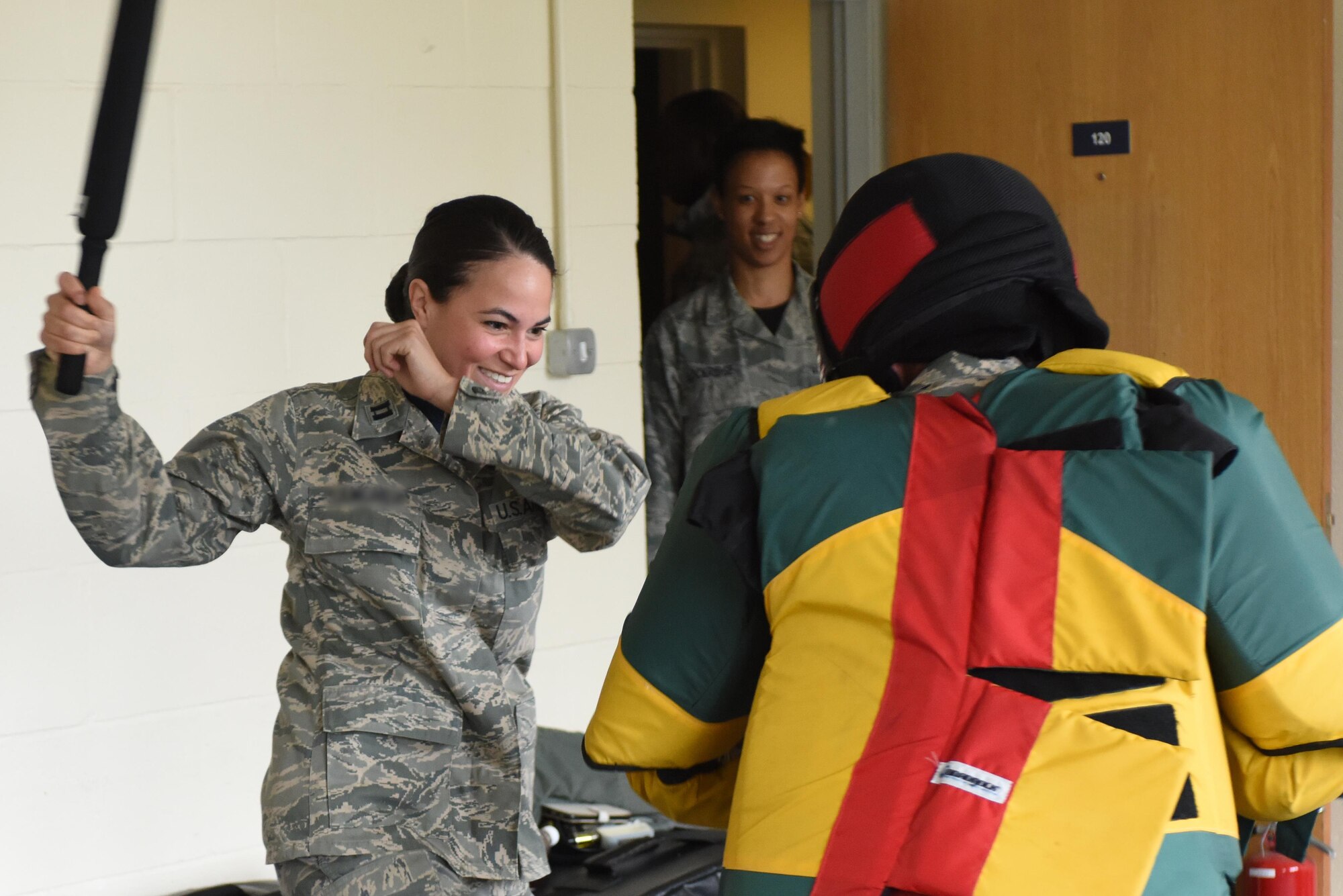 An Airman assigned to the 48th Fighter Wing learns how to swing a baton during an event for National Police Week at Royal Air Force Lakenheath, England, May 19. During the event, Airmen from all around base were given the opportunity to see what it is like to be a defender. (U.S. Air Force photo/Airman 1st Class Eli Chevalier)