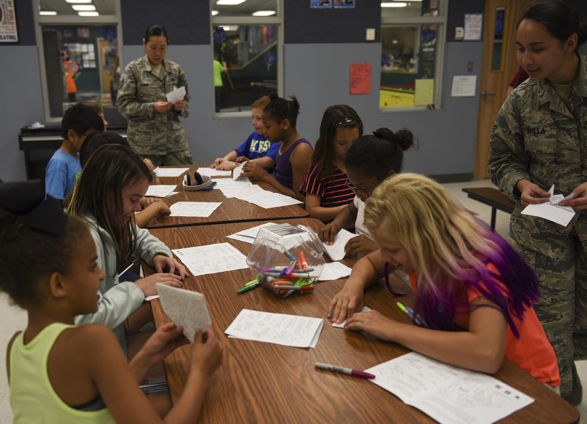 Members of the Asian Pacific American Heritage Association host an origami event for youth during Asian American Pacific Islander Heritage Month at Whiteman Air Force Base, Mo., May 10, 2017. The youth learned how to fold origami frogs, which is a symbol in Japanese culture for good fortune and it is often carried during travel to ensure the individual returns home safely. (U.S. Air Force courtesy photo by Staff Sgt. Rey Jee Quilla)