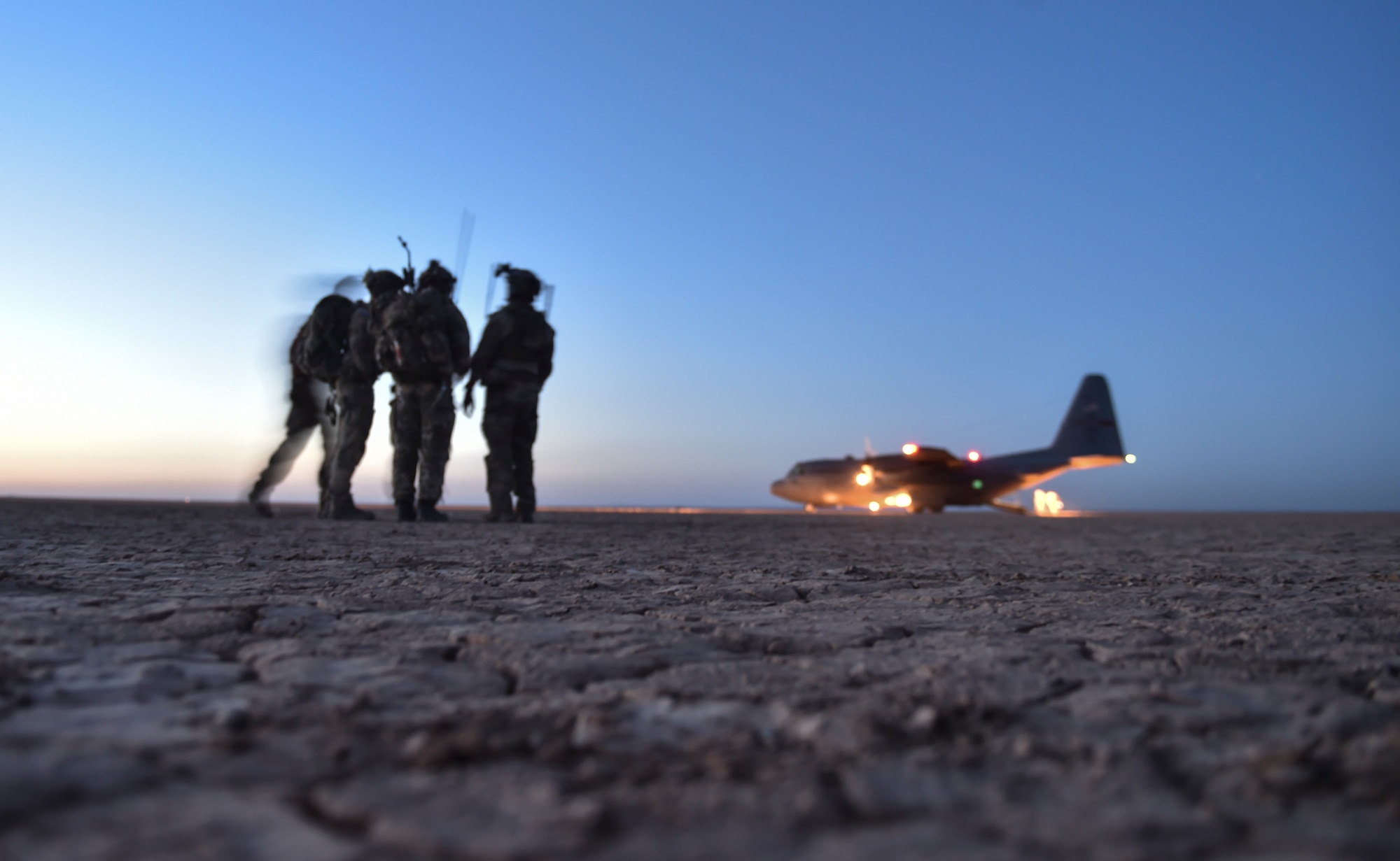 U.S. Air Force Special Tactics Airmen and Italy's 17th Stormo Incursori troops prepare to board an Ohio Air National Guard C-130H Hercules after it landed in a dry lake bed during Exercise Eager Lion, May 16, 2017, in Jordan. The joint special operations team assessed, opened, and controlled clandestine desert landing strip, which helped them train to provide strategic access for U.S. or allied partners. (U.S. Air Force photo by Senior Airman Ryan Conroy) 