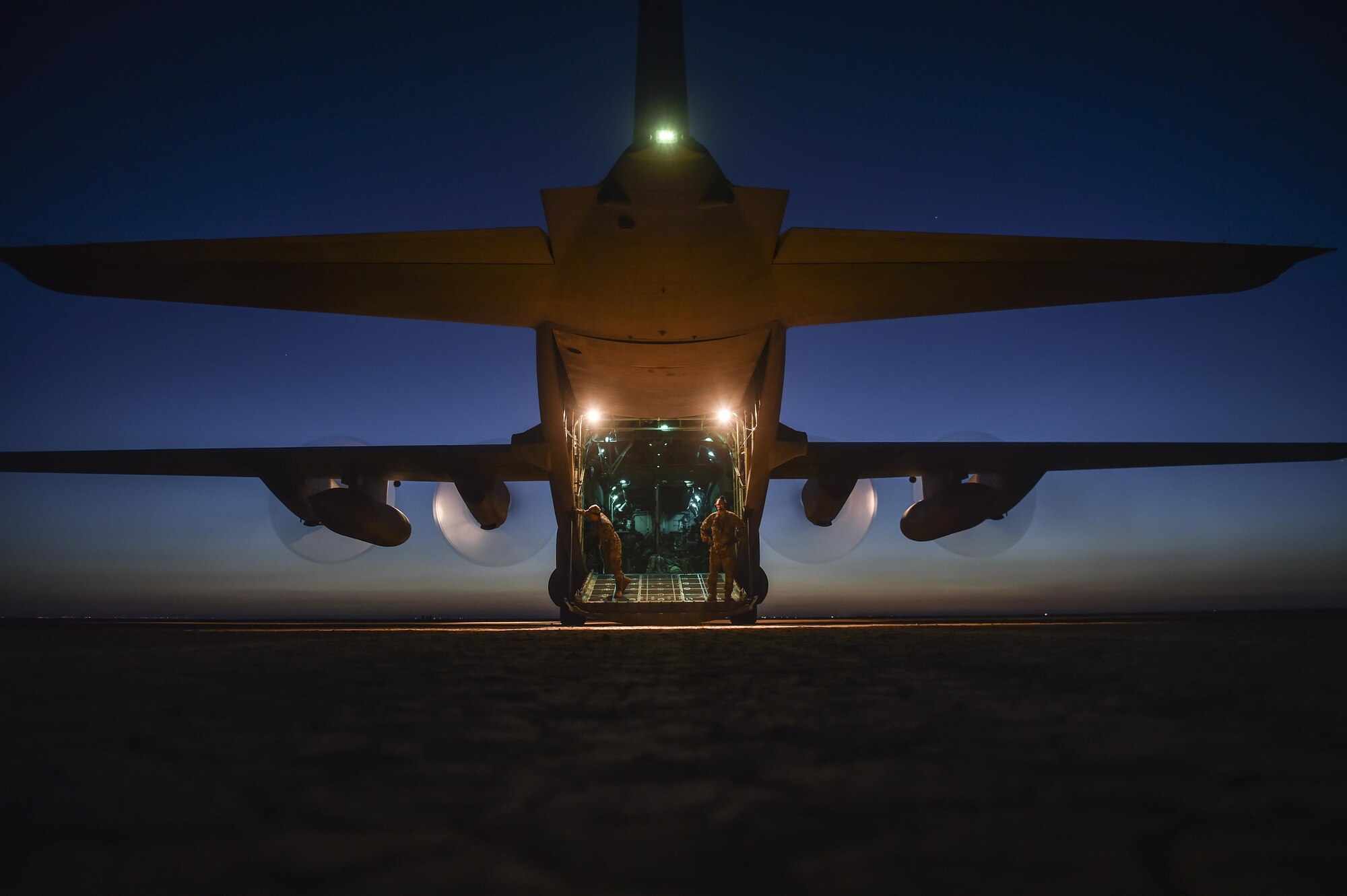 U.S. Air National Guard Airmen with the 127th Airlift Wing inspect a C-130H Hercules following a dry lake bed landing during Exercise Eager Lion, May 17, 2017, in Jordan. Eager Lion 2017, an annual U.S. Central Command exercise in Jordan designed to strengthen military-to-military relationships between the U.S., Jordan and other international partners. This year's iteration is comprised of about 7,200 military personnel from more than 20 nations that will respond to scenarios involving border security, command and control, cyber defense and battlespace management. (U.S. Air Force photo by Senior Airman Ryan Conroy) 