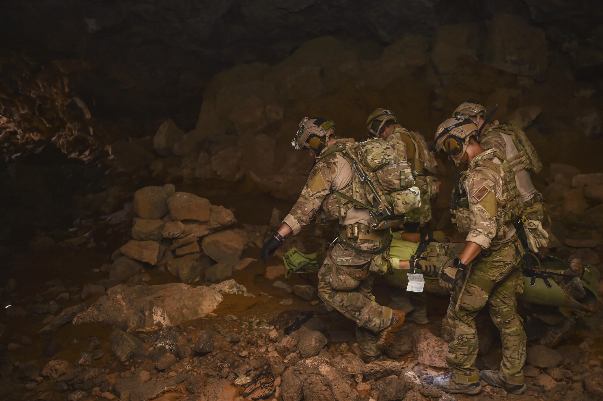 Air Force Special Tactics Airmen with the 24th Special Operations Wing and Italian special operations forces carry a simulated casualty through the Al Biadia Cave Complex during a personnel rescue mission for Eager Lion, May 13, 2017, in Mafraq Province, Jordan. Eager Lion 2017, an annual U.S. Central Command exercise in Jordan designed to strengthen military-to-military relationships between the U.S., Jordan and other international partners. This year's iteration is comprised of about 7,200 military personnel from more than 20 nations that will respond to scenarios involving border security, command and control, cyber defense and battlespace management. (U.S. Air Force photo by Senior Airman Ryan Conroy)