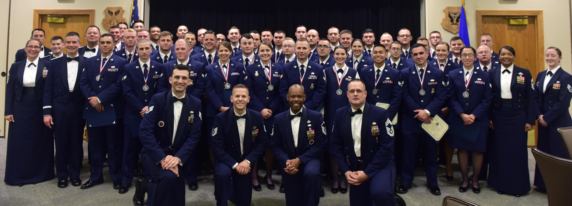 Graduates of Whiteman Airman Leadership School (ALS) class 17-D gather for a class photo after a graduation ceremony at Whiteman Air Force Base, Mo., May 4, 2017. ALS is a five-and-a-half week-long course that prepares senior airmen to supervise and lead Air Force teams, which supports the employment of air, space and cyberspace power. (U.S. Air Force photo by Senior Airman Jovan Banks)