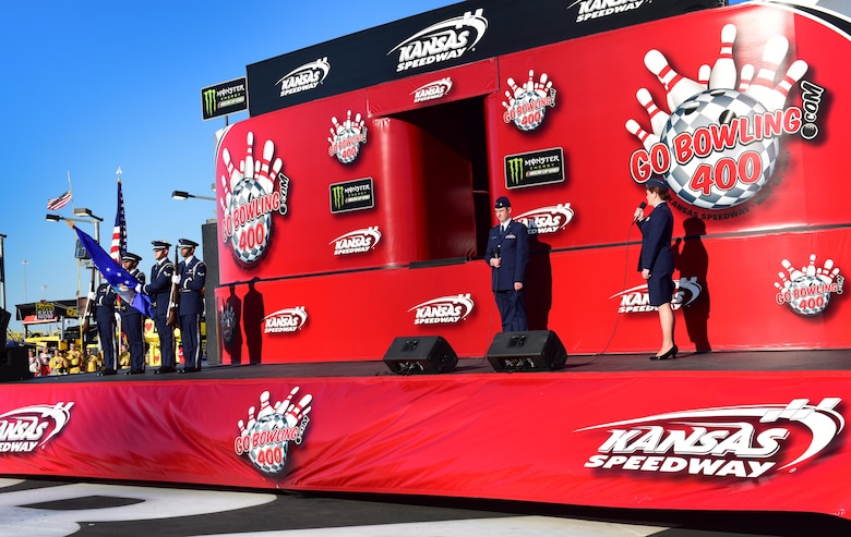 Airmen from Whiteman Air Force Base, Mo., participate in the pregame ceremonies prior to a NASCAR event at the Kansas City Speedway in Kansas City, Kan., May 13, 2017. Team Whiteman was invited to perform an A-10 Thunderbolt flyover, an invocation, the singing of the National Anthem and present the colors as part of a military outreach event. (U.S. Air Force photo by Airman Michaela R. Slanchik)