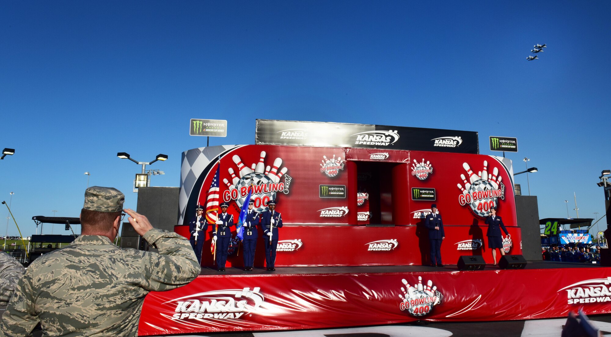 Airmen from Whiteman Air Force Base, Mo., participate in the pregame ceremonies prior to a NASCAR event at the Kansas City Speedway in Kansas City, Kan., May 13, 2017. Team Whiteman was invited to perform an A-10 Thunderbolt flyover, an invocation, the singing of the National Anthem and present the colors as part of a military outreach event. (U.S. Air Force photo by Airman Michaela R. Slanchik)