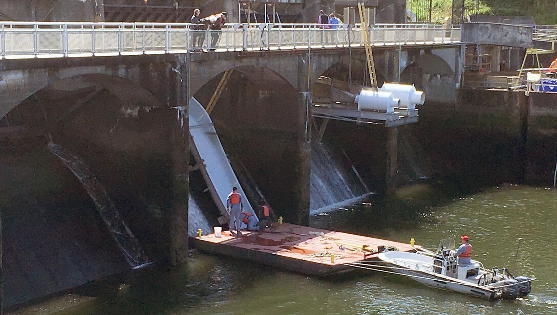 A team completes installation of a prototype smolt slide in April. U.S. Army Corps of Engineers officials continually look for ways to help salmon traverse the 100-year-old Hiram M. Chittenden Locks. 