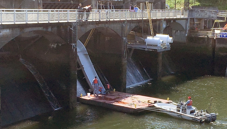 A team completes installation of a prototype smolt slide in April. U.S. Army Corps of Engineers officials continually look for ways to help salmon traverse the 100-year-old Hiram M. Chittenden Locks. 