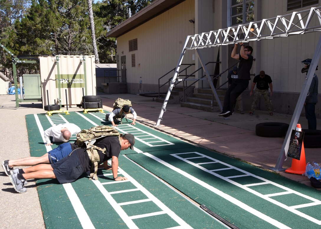 Team V members perform calisthenics during the 10K Warrior Challenge, May 16, 2017, Vandenberg Air Force Base, Calif. As part of National Police Week, 30th Security Forces Squadron will host various events to honor our Defenders as well as police nationwide. (U.S. Air Force photo by Airman 1st Class Clayton A. Wear/Released)