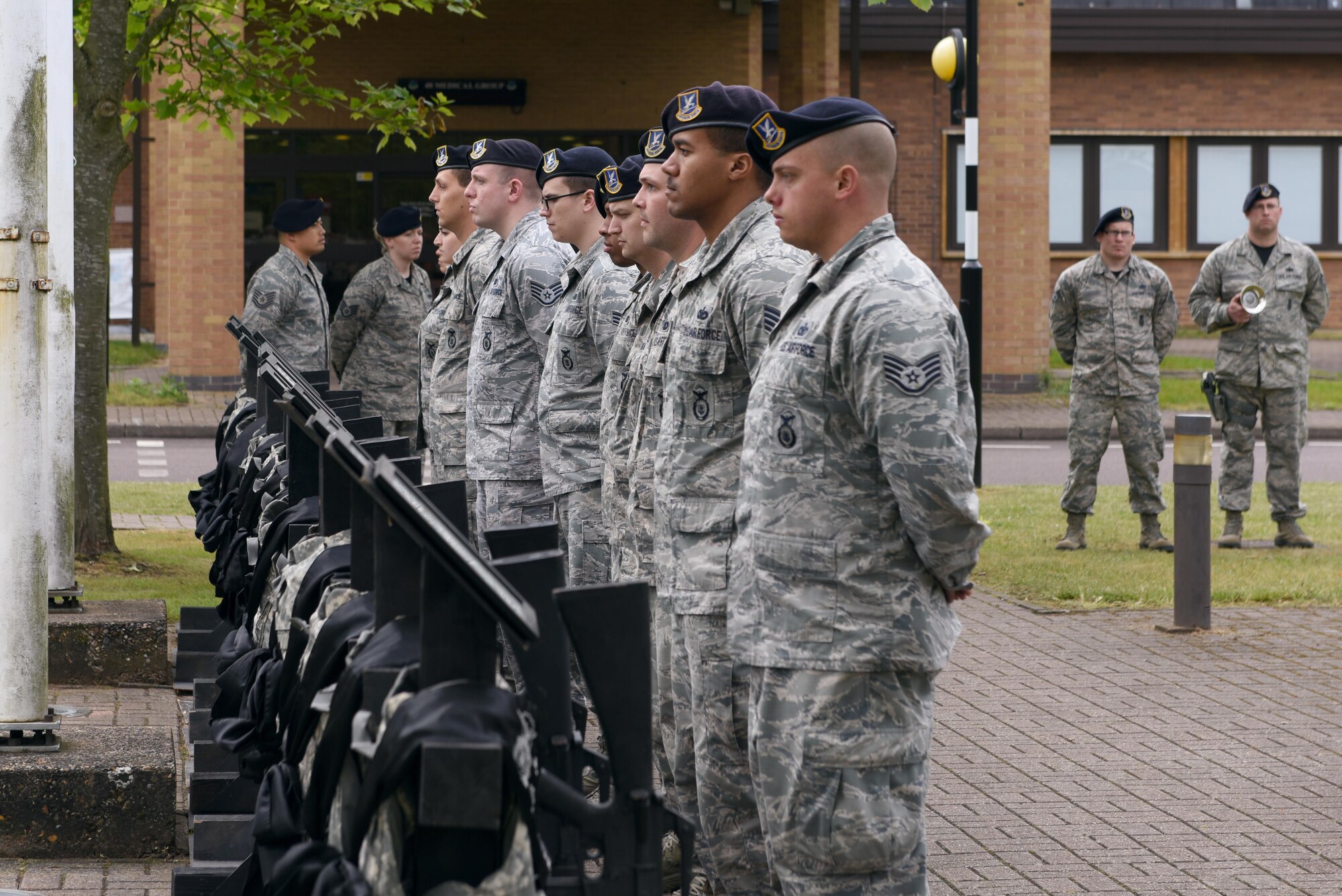 48th Security Forces Airmen honor the fallen during a ceremony at Royal Air Force Lakenheath, England, May 19. The ceremony honored the 14 Security Forces Airmen who lost their lives in combat since Operation Iraqi Freedom. (U.S. Air Force photo/Airman 1st Class John A. Crawford)