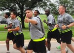 A Soldier gives a thumbs-up as he runs as part of the U.S. Army North-led celebration of the Army's birthday in 2013 at Joint Base San Antonio-Fort Sam Houston. 