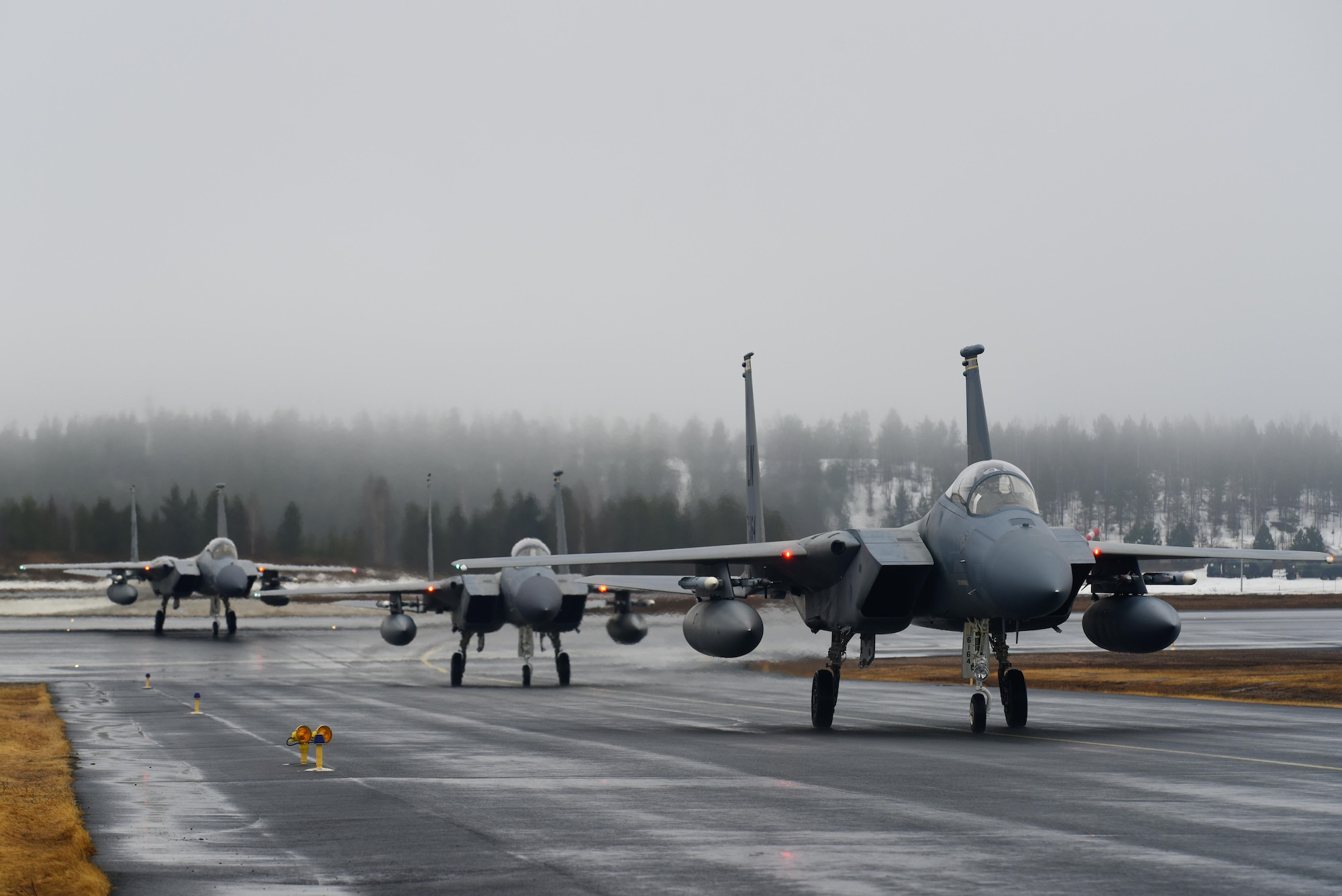 Three F-15C Eagles from Royal Air Force Lakenheath, England, taxi after landing at Rovaniemi Air Base, Finland, May 17, in support of Arctic Challenge 2017. The Reapers joined counterparts from 10 other nations, along with representatives from NATO, for the exercise to build on their expertise in the air and increase interoperability. (U.S. Air Force photo/Airman 1st Class Abby L. Finkel)