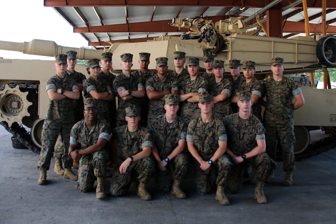 Lance Cpl. Mitch Gautreaux (top row, far left) and Pfc. Mitch Gautreaux (bottom row, second right) pose for a picture with their fellow Marines at the Squadron Intelligence Training Certification Course 17-05 at Marine Corps Base Camp Lejeune, N.C., May 16, 2017. Both Marines will soon be assigned to units in close proximity to one another after graduating from Squadron Intelligence Training Certification Course. Jason will be assigned to Marine Light Attack Helicopter Squadron 267 at Marine Corps Base Camp Pendleton, California, and Mitch will be assigned to Marine Heavy Helicopter Squadron 465 at Marine Corps Air Station Miramar, California. (U.S. Marine Corps photo by Cpl. Mackenzie Gibson/Released)
