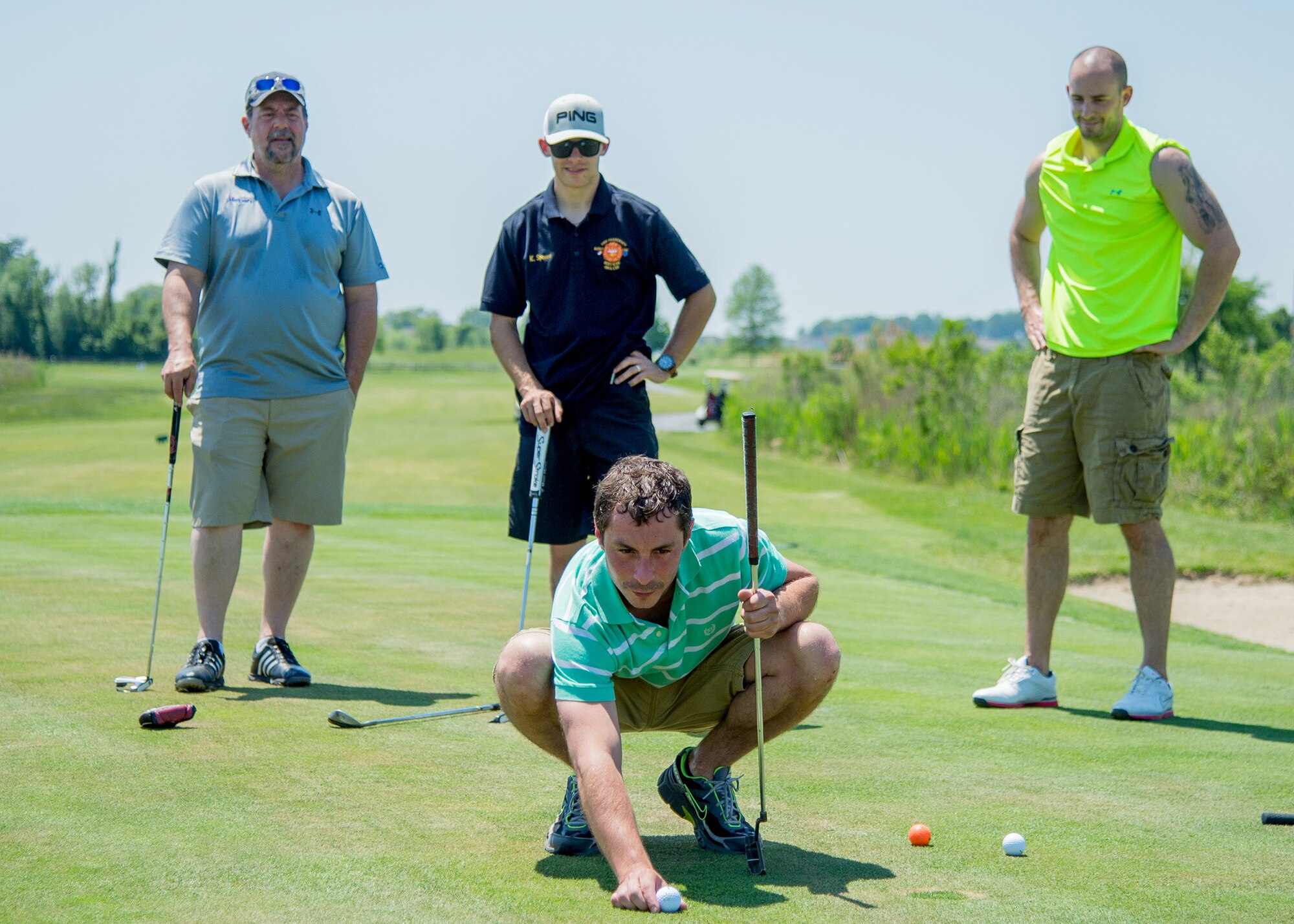 Dover realtor Anthony Lapinsky lines up a putt shot at the 2017 spring Bluesuiters Golf Tournament May 17, 2017, 2016, at the Jonathan’s Landing Golf Course in Magnolia, Delaware. Team Dover Airmen are paired up with local civic and business leaders to build and maintain good community relations. (U.S. Air Force photo by Mauricio Campino)