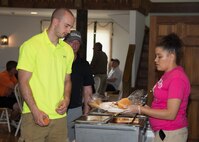 Participants of the 2017 spring Bluesuiters Golf Tournament grab some dinner May 17, 2017, 2016, at the Jonathan’s Landing Golf Course in Magnolia, Delaware. Dinner was sponsored by Shore United Bank and provided by Where Pigs Fly of Dover. (U.S. Air Force photo by Mauricio Campino)
