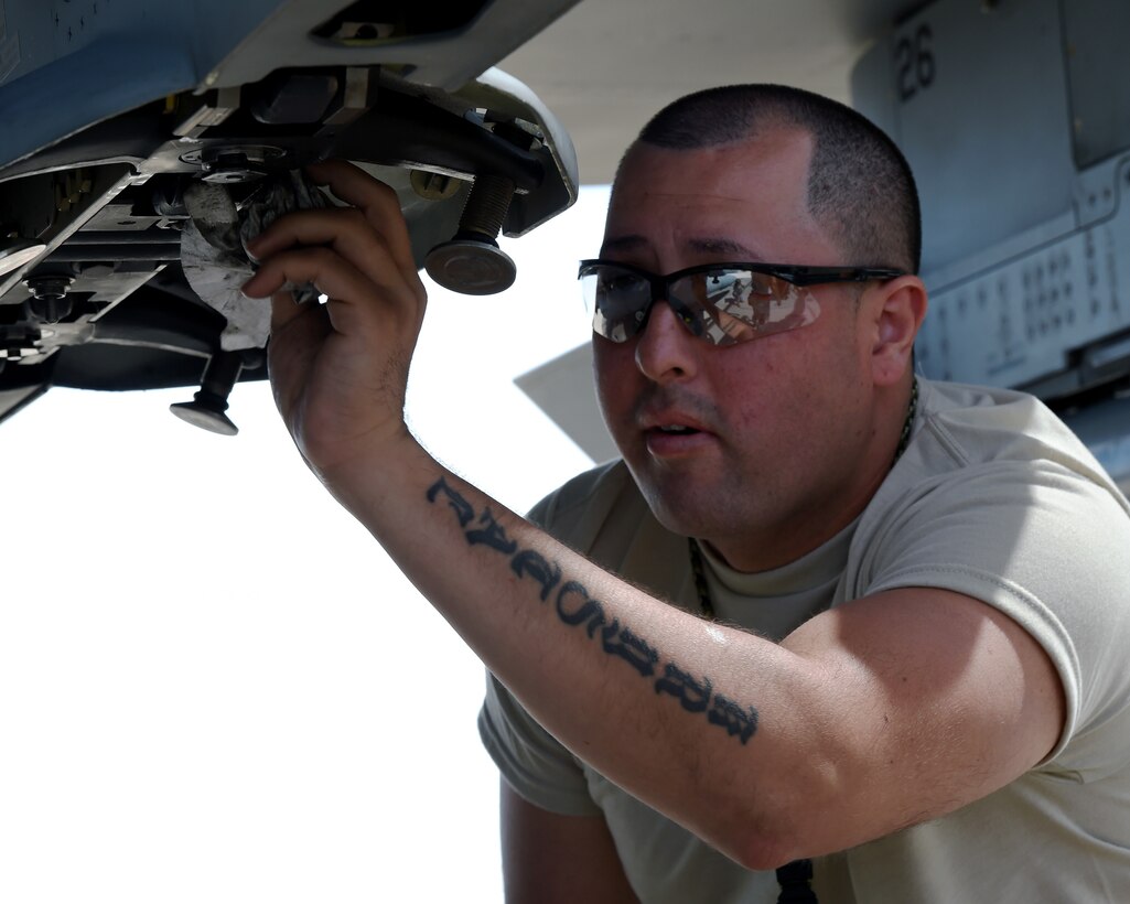Staff Sgt. Joseph Ramos, a weapons loader assigned to the 149th Fighter Wing, Air National Guard, conducts post-flight checks of an F-16 Fighting Falcon during Coronet Cactus at Davis-Monthan Air Force Base, Ariz., May 10, 2017. Coronet Cactus is an annual training event that takes members of the 149th Fighter Wing, headquartered at Joint Base San Antonio-Lackland, Texas, to Tucson, Arizona to participate in an simulated deployment exercise. (Air National Guard photo by Tech. Sgt. Mindy Bloem)