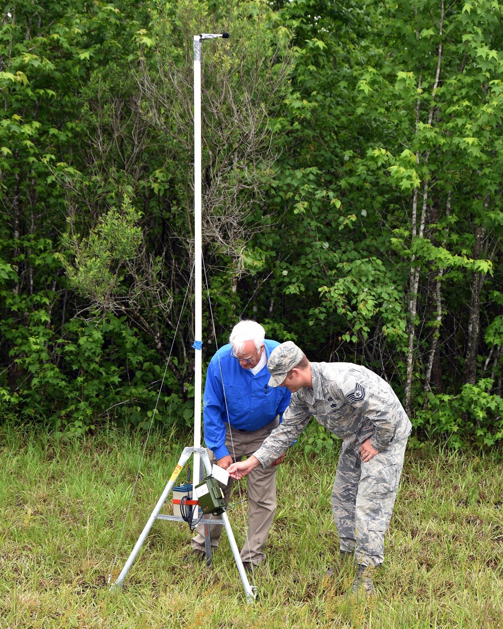 Frank Lockhart, 14th Civil Engineer Squadron Conservation Manager, and Tech. Sgt. Andrew McAnally, 14th Civil Engineer Squadron Noncommissioned Officer in Charge of Construction Management, uses an acoustical receiver to conduct a bat survey May 4, 2017, at Columbus Air Force Base, Mississippi. Five acoustical receivers were placed around the base and will record the bat high frequency sound waves for three months after which the recordings will be analyzed and each bat will be identified. (U.S. Air Force photo by Sharon Ybarra)