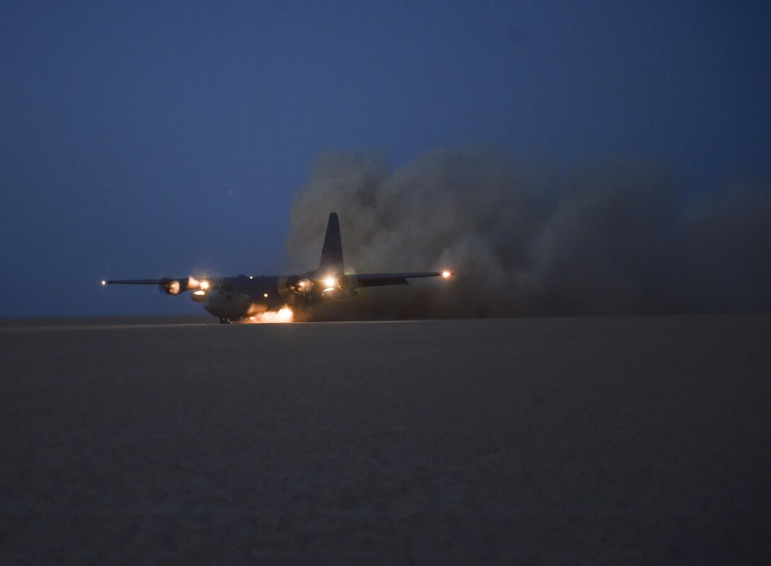 A U.S. Air Force Air National Guard C-130 Hercules with the 127th Airlift Wing controlled by a U.S. Air Force Special Tactics combat controller, lands in a dry lake bed during Exercise Eager Lion May 16, 2017, in Jordan. Special Tactics teams can assess, open, and control major airfields to clandestine dirt strips in either permissive or hostile locations, providing strategic access for U.S. or allied partners. (U.S. Air Force photo by Senior Airman Ryan Conroy)