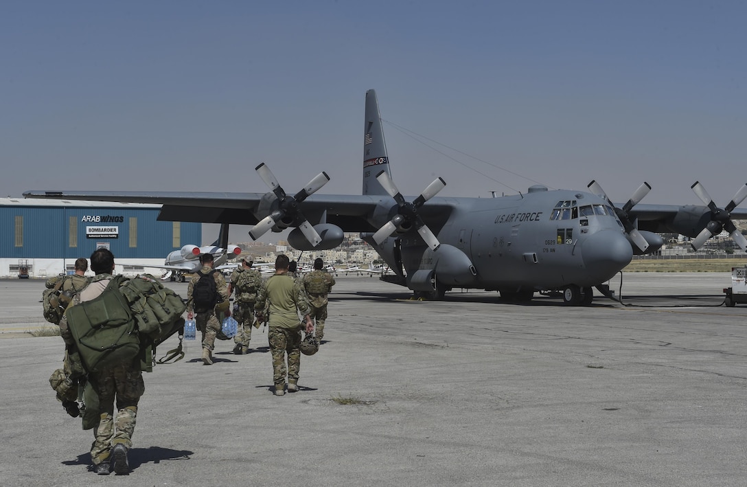 U.S. Air Force Special Tactics Airmen with the 24th Special Operations Wing and Italy's 17th Stormo Incursori troops prepare to board an Ohio Air National Guard C-130H Hercules before a military free fall during Exercise Eager Lion May 16, 2017, at Marka International Airport, Jordan. Eager Lion 2017, an annual U.S. Central Command exercise in Jordan designed to strengthen military-to-military relationships between the U.S., Jordan and other international partners. This year's iteration is comprised of about 7,200 military personnel from more than 20 nations that will respond to scenarios involving border security, command and control, cyber defense and battlespace management. (U.S. Air Force photo by Senior Airman Ryan Conroy)