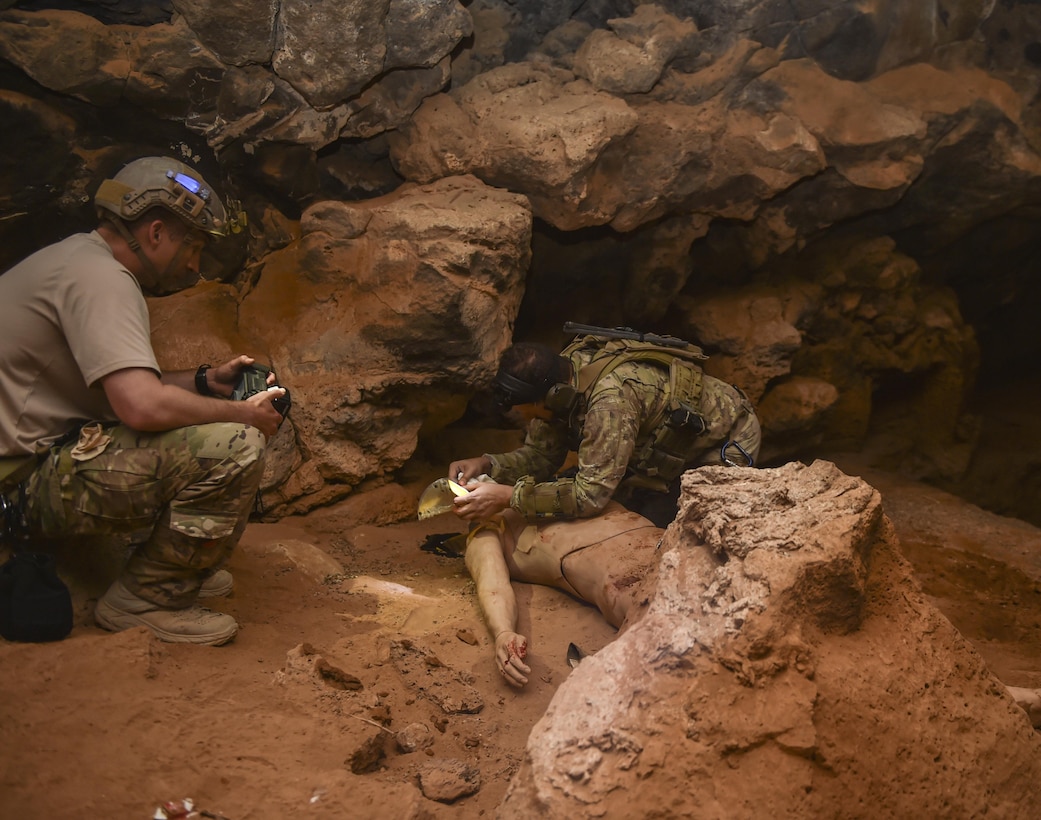 An Italian special operations force member condcuts tactical combat casualty care on a simulated gun-shot wound victim in the Al Biadia Cave Complex during a personnel rescue mission for Eager Lion May 13, 2017, in Mafraq Province, Jordan. Eager Lion 2017, an annual U.S. Central Command exercise in Jordan designed to strengthen military-to-military relationships between the U.S., Jordan and other international partners. This year's iteration is comprised of about 7,200 military personnel from more than 20 nations that will respond to scenarios involving border security, command and control, cyber defense and battlespace management. (U.S. Air Force photo by Senior Airman Ryan Conroy)