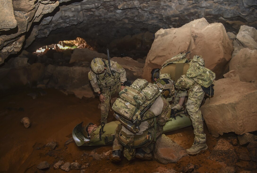 Air Force Special Tactics Airmen with the 24th Special Operations Wing and Italian special operations forces carry a simulated casualty through the Al Biadia Cave Complex during a personnel rescue mission for Eager Lion May 13, 2017, in Mafraq Province, Jordan. Eager Lion 2017, an annual U.S. Central Command exercise in Jordan designed to strengthen military-to-military relationships between the U.S., Jordan and other international partners. This year's iteration is comprised of about 7,200 military personnel from more than 20 nations that will respond to scenarios involving border security, command and control, cyber defense and battlespace management. (U.S. Air Force photo by Senior Airman Ryan Conroy)