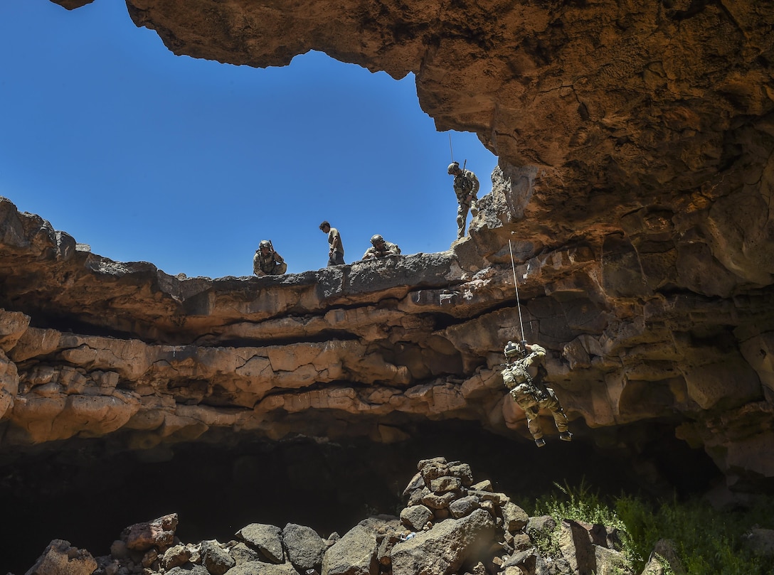 An Air Force Special Tactics Airman with the 24th Special Operations Wing rappels into the Al Biadia Cave Complex during a personnel rescue mission for Eager Lion May 13, 2017, in Mafraq Province, Jordan. Special Tactics teams have the ability to conduct personnel recovery missions, from rapid mission planning to technical rescue, treatment and exfiltration. With in-depth medical and rescue expertise, along with their deployment capabilities, ST Airmen are able to perform rescue missions in the world's most remote areas.(U.S. Air Force photo by Senior Airman Ryan Conroy)