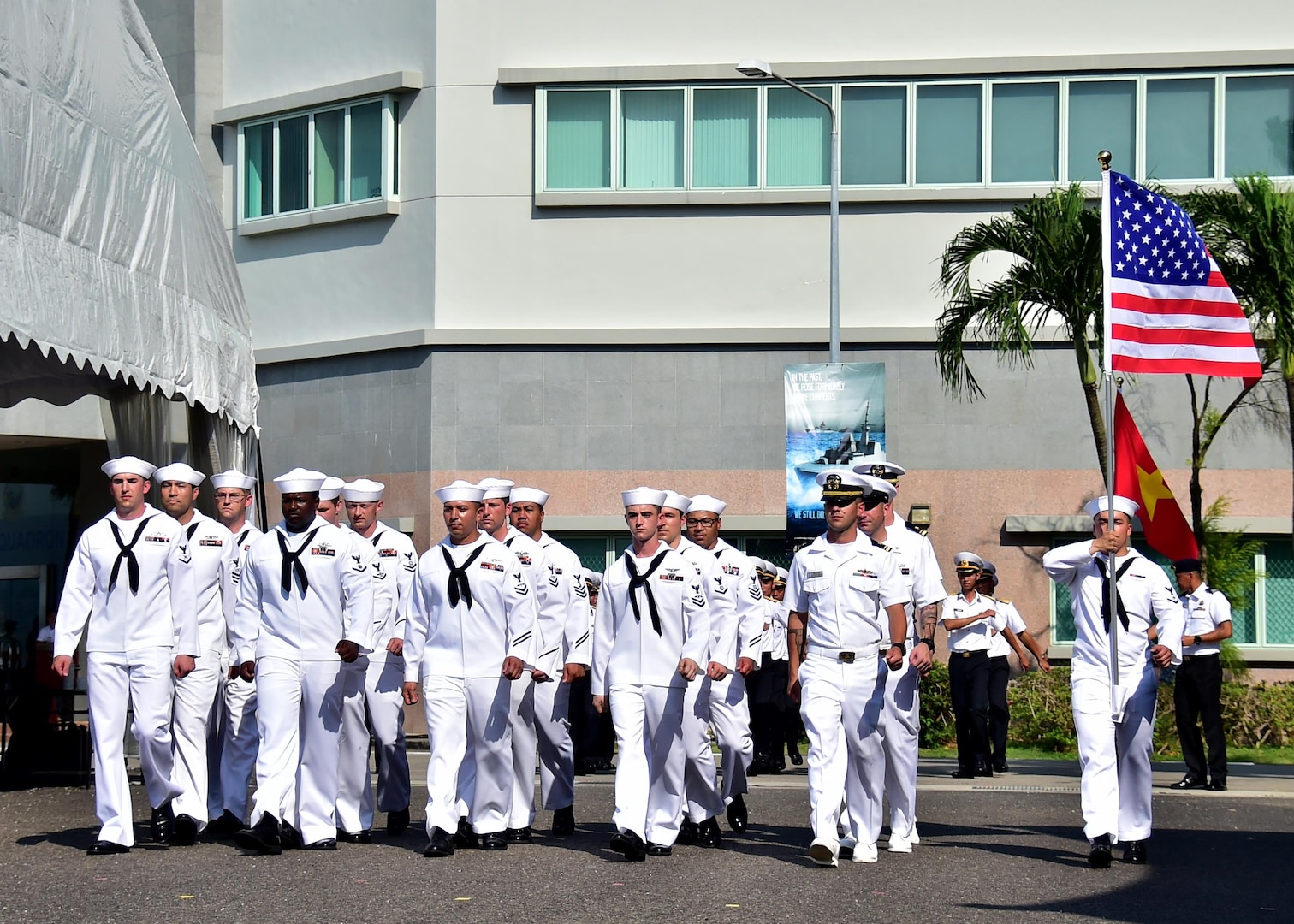 Sailors assigned to the Arleigh Burke-class guided missile destroyer USS Sterett (DDG 104) march in formation at the international honor guard delegation during the International Maritime Review and 50th anniversary of the Republic of Singapore Navy at RSS Singapura-Changi Naval Base, May 15, 2017. The International Maritime Defense Exhibition 2017 is hosted by the Republic of Singapore and is one of the largest maritime exhibitions in the Asia Pacific and features a trade show and a series of multilateral exercises and exchanges. 