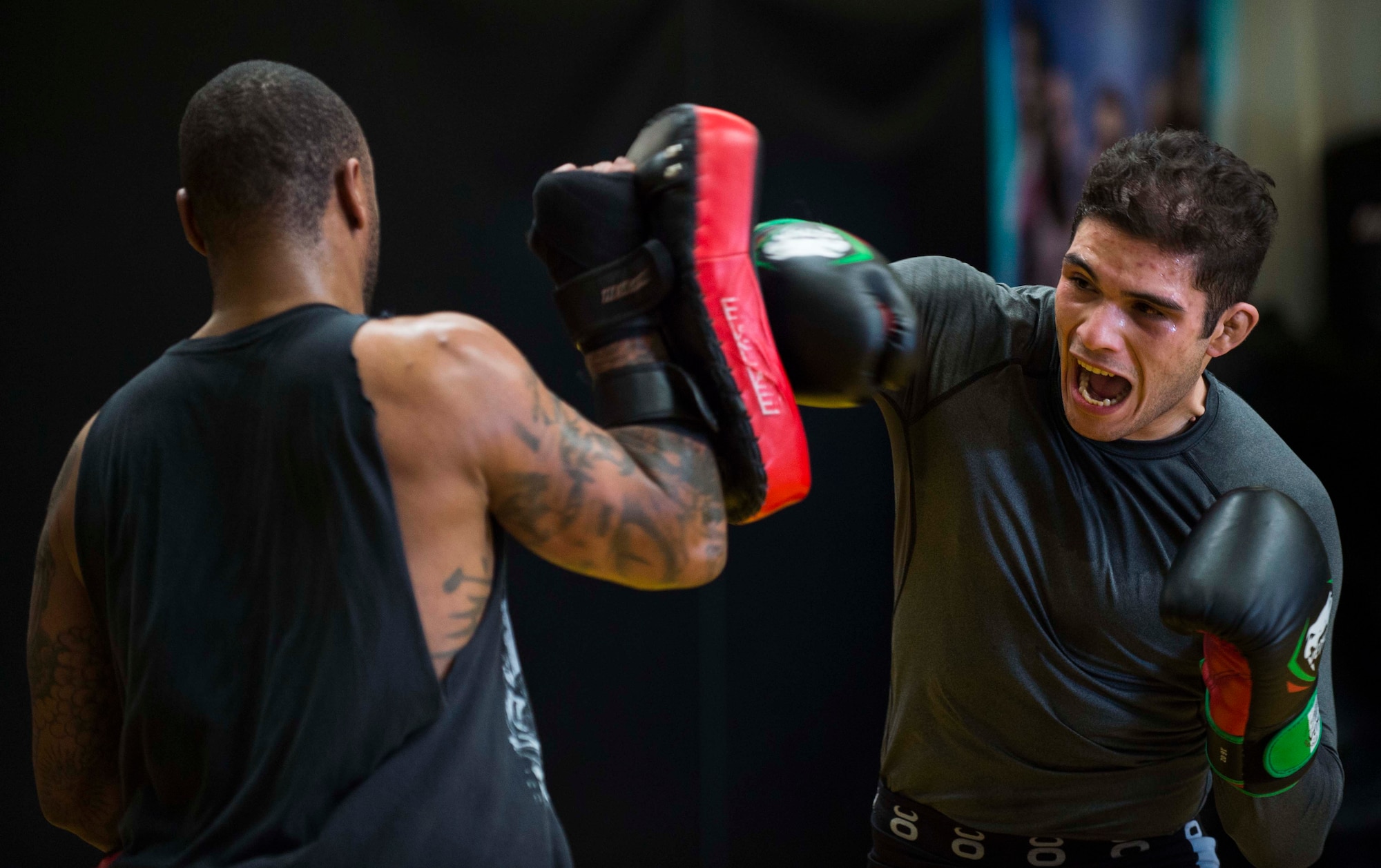 Airman 1st Class Raul Veliz, 90th Missile Security Forces Squadron response force leader, throws punches during practice at Trials Mixed Martial Arts gym in Fort Collins Colo., May 5, 2017. Veliz has been fighting MMA for almost two years. He is stationed at F.E. Warren Air Force Base, Wyo. (U.S. Air Force photo by Staff Sgt. Christopher Ruano)